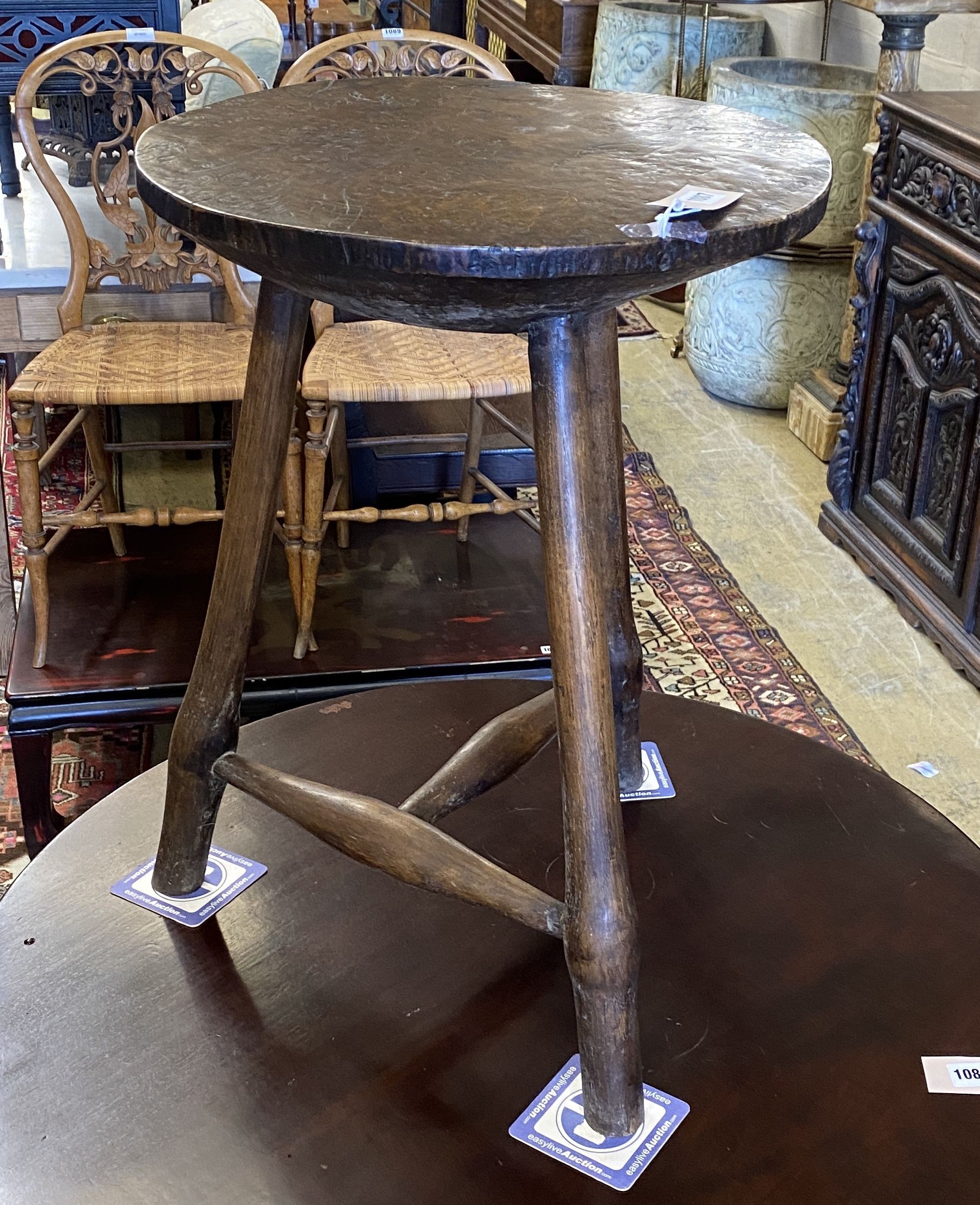 A late 18th / early 19th century circular burr elm and ash cricket table, diameter 60cm, height 62cm